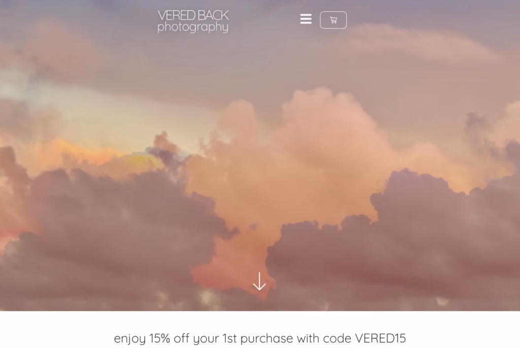 Vered Back Photography homepage with pastel sky imagery and minimal white navigation
